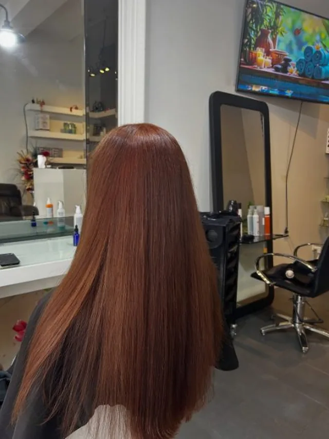 Long copper hair colour result at Akila Oakleigh