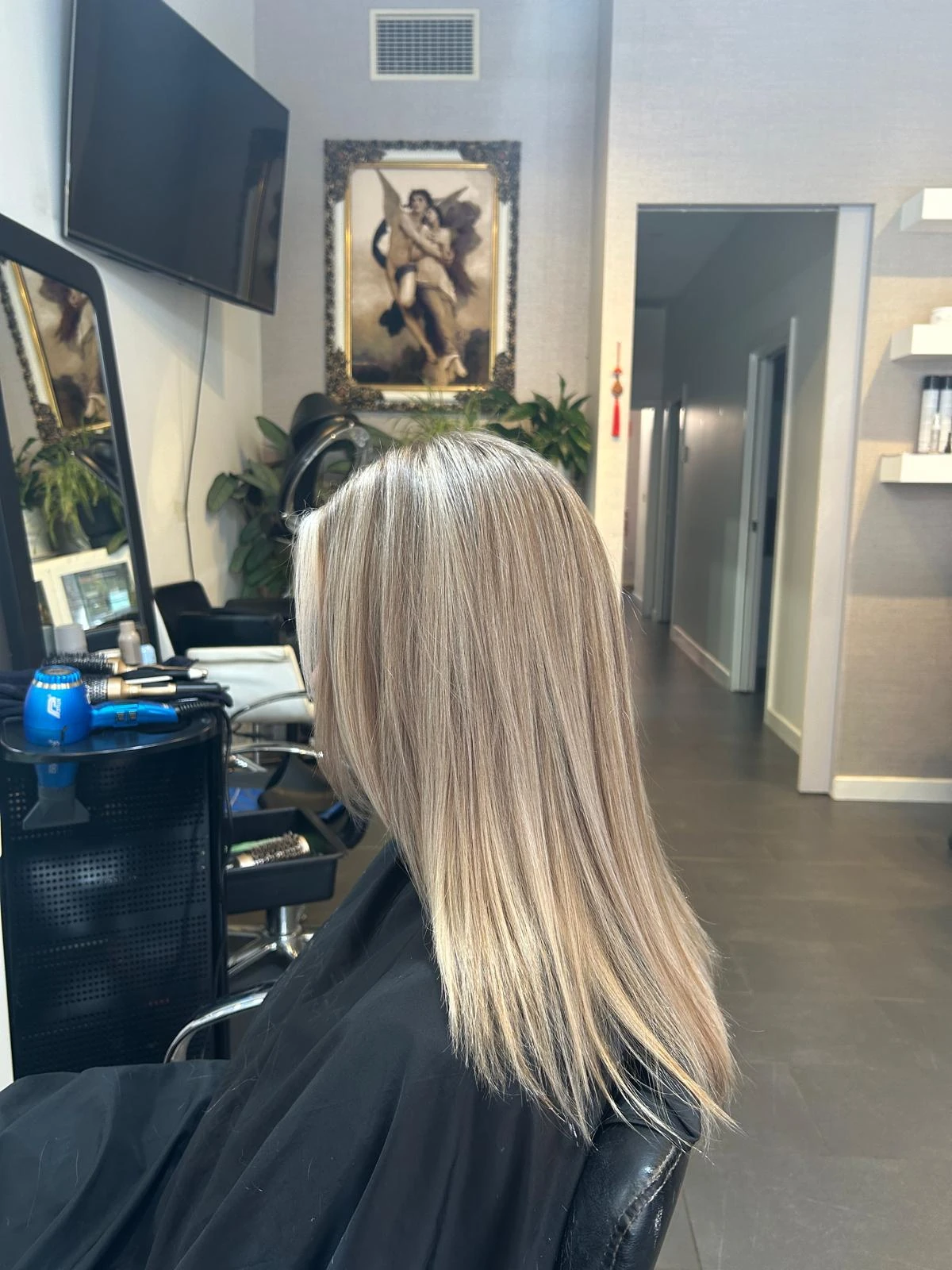 After balayage: cool ash blonde through the same length, brass toned out, at Akila in Oakleigh