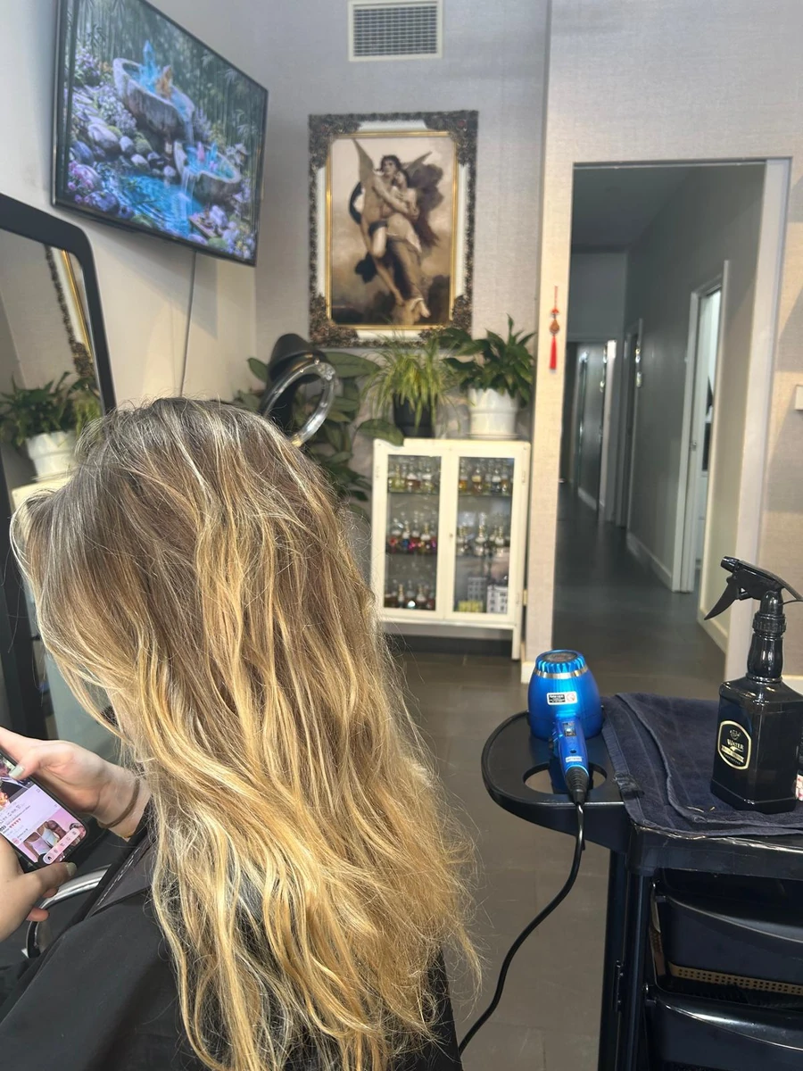 Before balayage: warm blonde hair gone brassy through the lengths, at Akila in Oakleigh