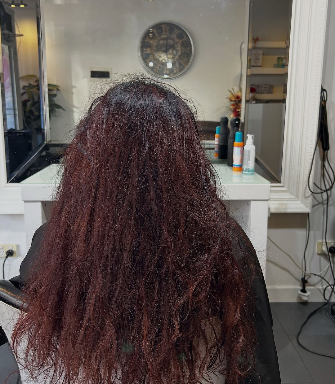 Frizzy burgundy hair before Brazilian keratin at Akila Oakleigh