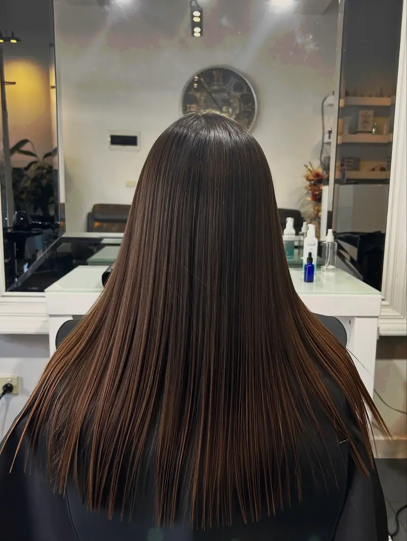Smooth, glossy dimensional hair result after a Cacau Brasil Nanoplastia treatment at Akila Oakleigh