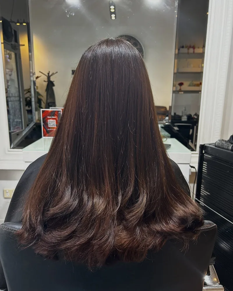 Glossy brunette corrective colour result at Akila in Oakleigh