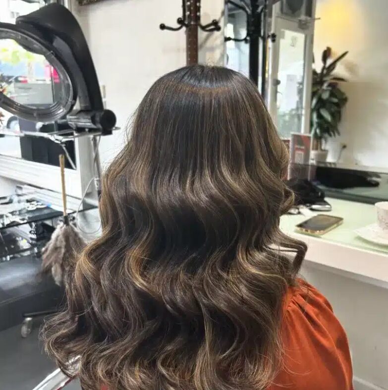 Brunette waves with caramel highlights